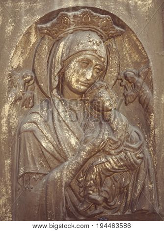 statue of the Virgin Mary with the baby Jesus Christ (Religion faith eternal life God the soul concept)