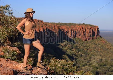 Girl Using Hat At An African Landscape. Waterberg Plateau, Namibia