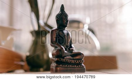 Buddha Statue At The Tea Ceremony Close-up