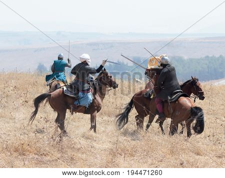 Tiberias Israel July 01 2017 : Participants in the reconstruction of Horns of Hattin battle in 1187 participate in the battle on horseback on the battlefield near TIberias Israel