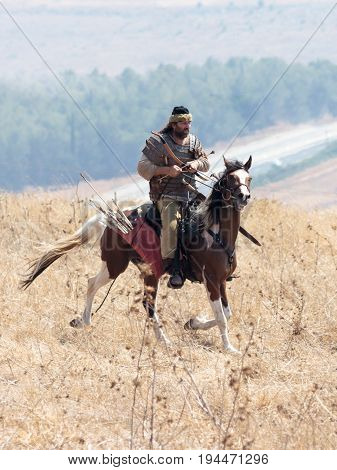 Tiberias Israel July 01 2017 : Participants in the reconstruction of Horns of Hattin battle in 1187 participate in the battle rides on the battlefield near TIberias Israel