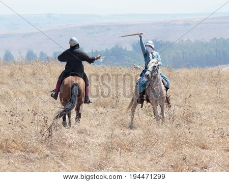 Tiberias Israel July 01 2017 : Participants in the reconstruction of Horns of Hattin battle in 1187 participate in the battle on horseback on the battlefield near TIberias Israel
