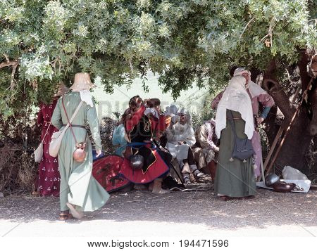 Tiberias Israel July 01 2017 : Participants in the reconstruction of Horns of Hattin battle in 1187 rest on a halt along the way to the battlefield near TIberias Israel
