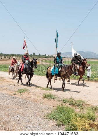 Tiberias Israel July 01 2017 : Participants in the reconstruction of Horns of Hattin battle in 1187 left the camp on horseback and ride go to the battle site near TIberias Israel
