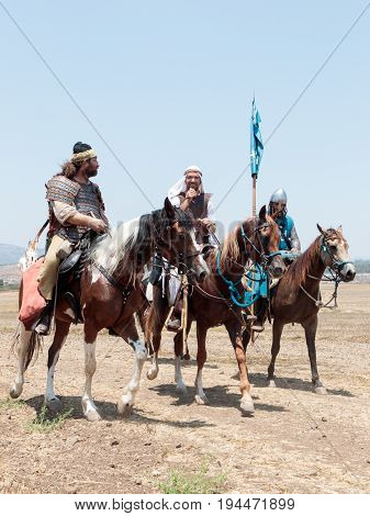 Tiberias Israel July 01 2017 : Participants in the reconstruction of Horns of Hattin battle in 1187 left the camp on horseback and go to the battle site near TIberias Israel