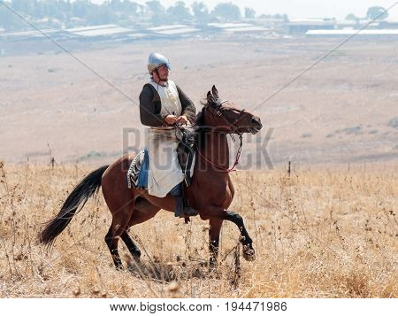 Tiberias Israel July 01 2017 : Participants in the reconstruction of Horns of Hattin battle in 1187 moving around the battlefield near Tiberias Israel