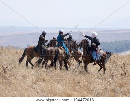 Tiberias Israel July 01 2017 : Participants in the reconstruction of Horns of Hattin battle in 1187 participate in the battle on horseback on the battlefield near TIberias Israel