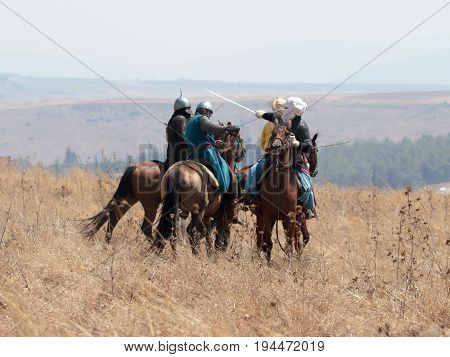 Tiberias Israel July 01 2017 : Participants in the reconstruction of Horns of Hattin battle in 1187 participate in the battle on horseback on the battlefield near TIberias Israel