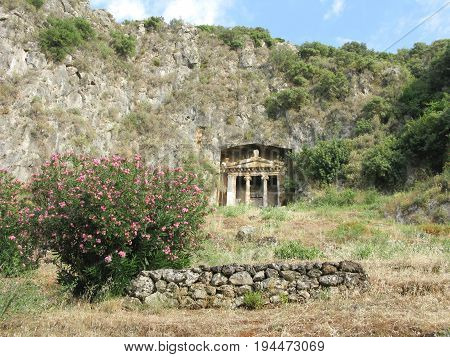 ancient rock tomb in the mountains in fethiye turkey