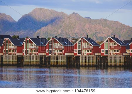 Beautiful super wide-angle panoramic aerial view of Tromso, Norway with harbor and skyline with scenery beyond the city, sunny summer day with blue sky