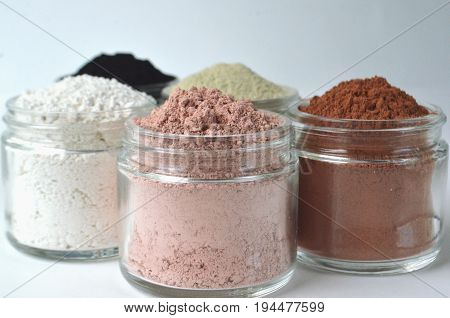 A set of four cosmetic clays for facial masks top view