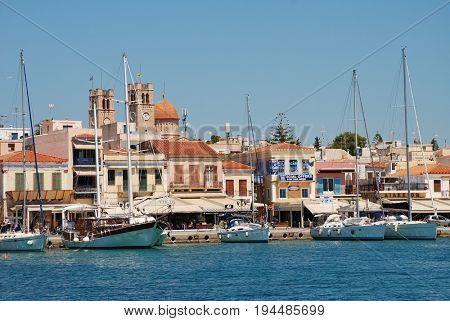 AEGINA, GREECE - APRIL 26, 2017: Boats moored in the harbour at Aegina Town on the Greek island of Aegina. Under an hour from Piraeus, the island is a popular destination for Athenians. 