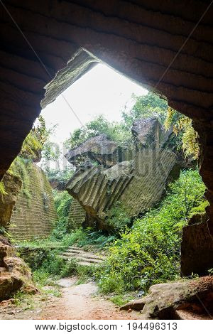 The exploitation of limestone hills canyon forming a unique architectural in Arosbaya Hill Madura Island, Indonesia
