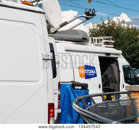 STRASBOURG FRANCE - JUN 30 2017: Via Storia TV Media Television Trucks with multiple Satellite parabolic antennas and fiber optic cables preparing to report live the official European Ceremony of Honour for Dr. Helmut Kohl at European Parliament