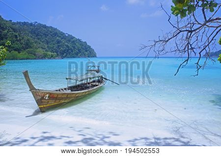 sea beach ship boat long tail boat blue sky at surin island Thailand