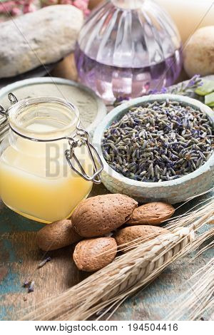 Nature cosmetics handmade preparation with essential oils and ancient minerals of parfums skincare creams soaps from fresh and dried lavender flowers roses wheat almond nuts green clay powder in French artisanal boutique home style