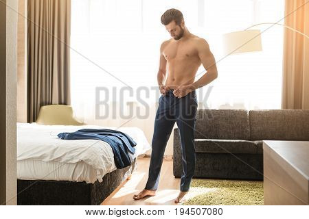 Young male business traveler hotel accomodation dress