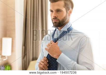 Young male business traveler hotel accomodation dress