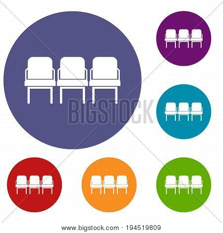Chairs in the departure hall at airport icons set in flat circle reb, blue and green color for web