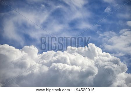 Dramatic Cumulus Clouds With High Level Cirrocumulus Clouds For Use As Background