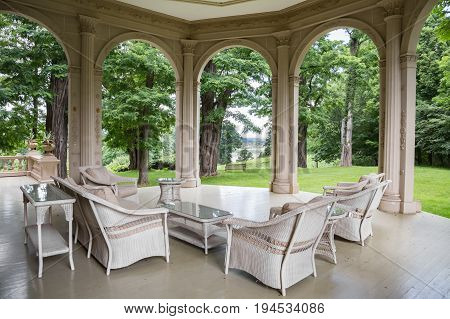 RED HOOK, NY, USA - JULY 3,2017: MONTGOMERY PLACE ESTATE. A historic landmark in Dutchess County, NY. Shown here is the porch on the north side of the main house.