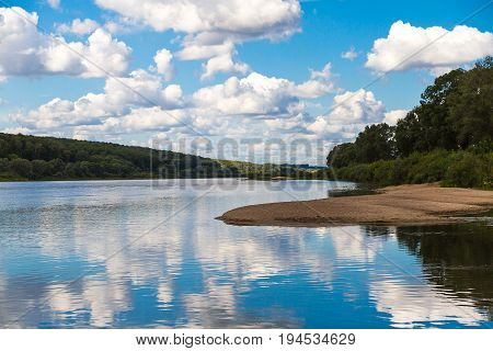 Panoramic picture of the bend of the river on a bright sunny spring day