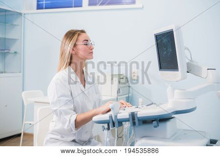 Ultrasound machine, doctor's hand usg investigation USCG.
