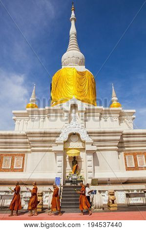 MAHASARAKHAM THAILAND - JULY82017 : thai buddha munk praying around Prathat Nadun pagoda most important buddhism place in Mahasarakham province north eastern of thailand
