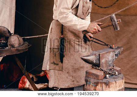 Blacksmiths work as forging forging on metal. The concept of making products from iron.