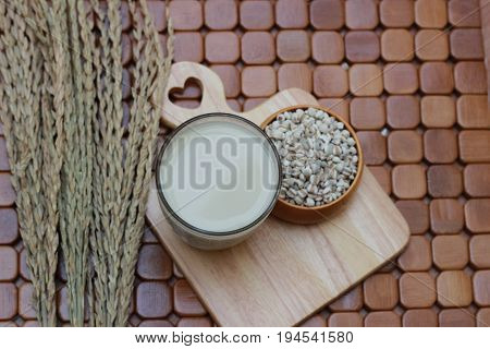 Coix lacryma-jobi, boiled in a glass on a brown background
