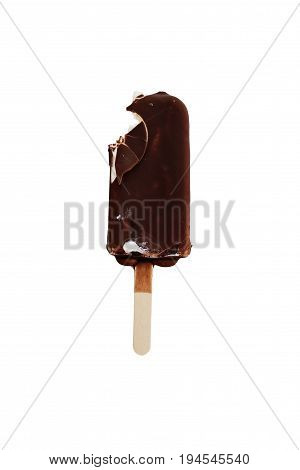 Bitten chocolate covered vanilla ice cream bar on a wooden stick isolated over a white background. Clipping path included.