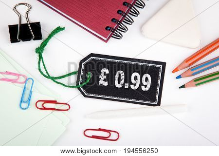 0.99 pound pence. Price tag with string on a white background.