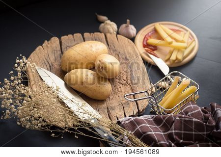 Deep Fried Potato Slice And Potato On Wooden Baord For Cooking