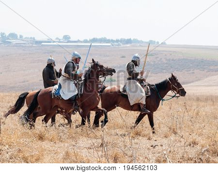 Tiberias Israel July 01 2017 : Participants in the reconstruction of Horns of Hattin battle in 1187 moving around the battlefield near Tiberias Israel