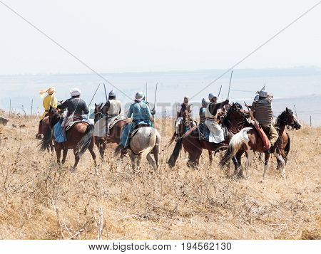 Tiberias Israel July 01 2017 : Participants in the reconstruction of Horns of Hattin battle in 1187 participate in the battle on horseback on the battlefield near Tiberias Israel