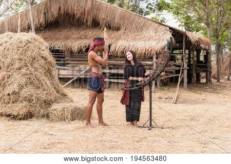 Asian beautiful girl are happy playing Pong Lang is a Thai musical instrument in summer at Countryside.