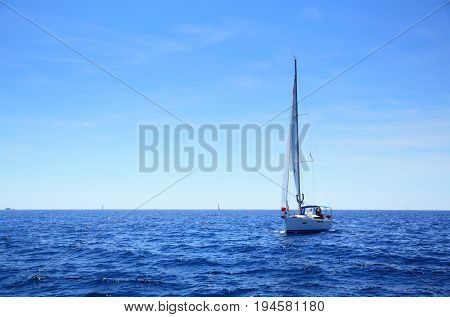 Seascape - Sea horizon and samall yacht