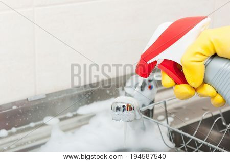 Maid Or Housewife Cleans The Kitchen