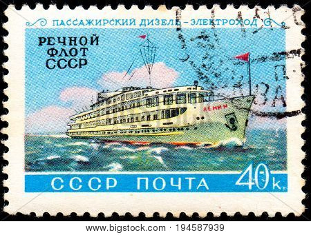 UKRAINE - CIRCA 2017: A postage stamp printed in USSR shows ship and Inscription Passenger Diesel-electric River Fleet of USSR from the series Domestic fleet circa 1960