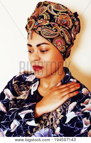 beauty bright african woman with creative make up, shawl on head like cubian closeup smiling, cheerful tan , lifestyle people concept close up