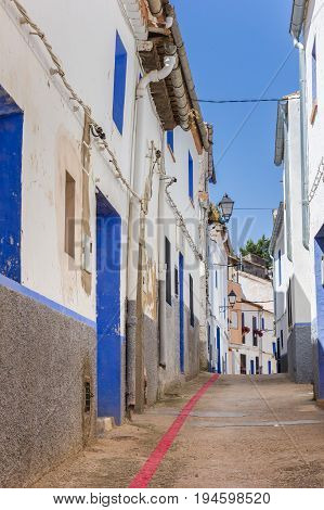 Red Line Running Through A Narrow Street In Ayora