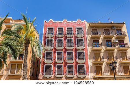 Colorful Red Apartment Building At The Main Square Of Ayora