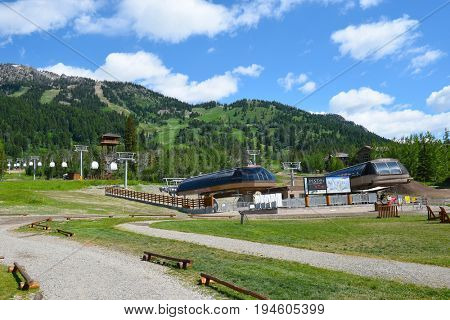 JACKSON HOLE, WYOMING - JUNE 27, 2017: Teewinot Chairlift and Sweetwater Gondola at Teton Village, Jackson Hole, Wyoming.