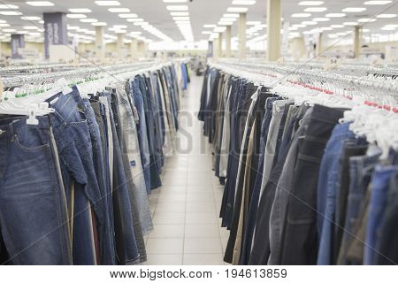 The jeans on the hanger counter in the store