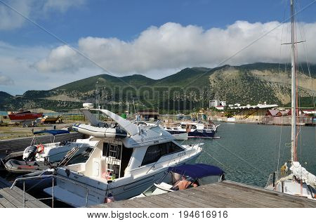 ANAPA, RUSSIA - JUNE 07, 2017: Cruise yachts moored to pier in waters of the Bolshoy Utrish