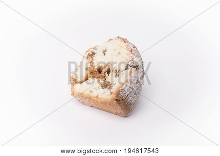 Homemade cupcake with powdered sugar raisins and caramel in a cut isolated on a white background