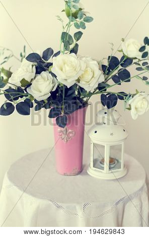 Rose placed on the desk in blue background
