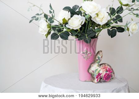 Rose placed on the desk in blue background