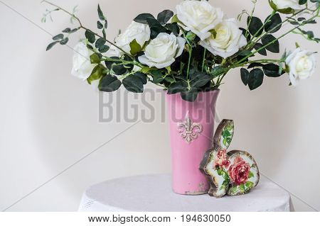 Rose placed on the desk in blue background