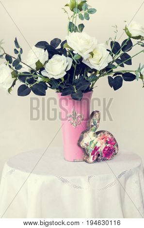 Rose placed on the desk in blue background